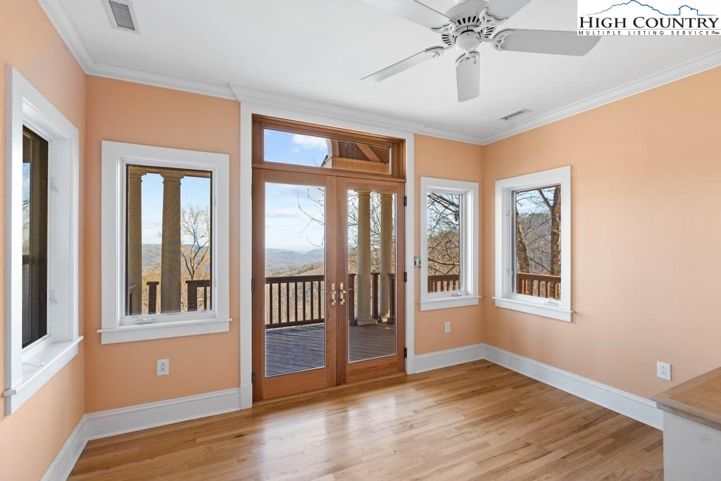 461 Summit Rise Drive Boone, NC 28607 - Photo 38 of 50 a view of an empty room with wooden floor and a window