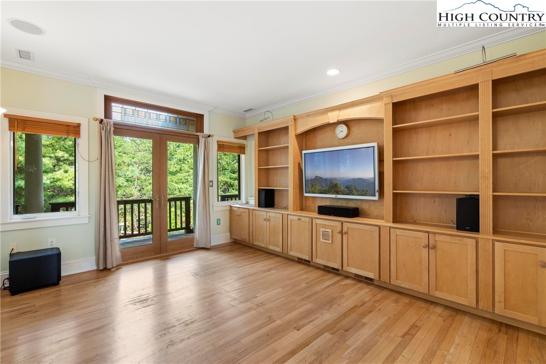 461 Summit Rise Drive Boone, NC 28607 - Photo 39 of 50 a view of an empty room with wooden floor and a window