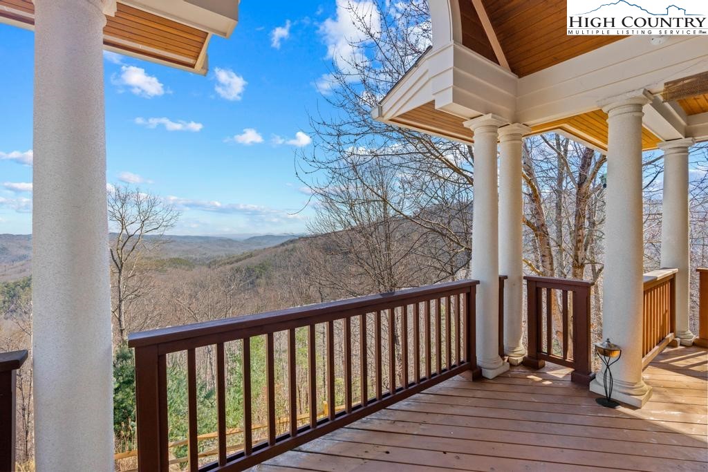 461 Summit Rise Drive Boone, NC 28607 - Photo 41 of 50 a view of a balcony with wooden floor and iron fence