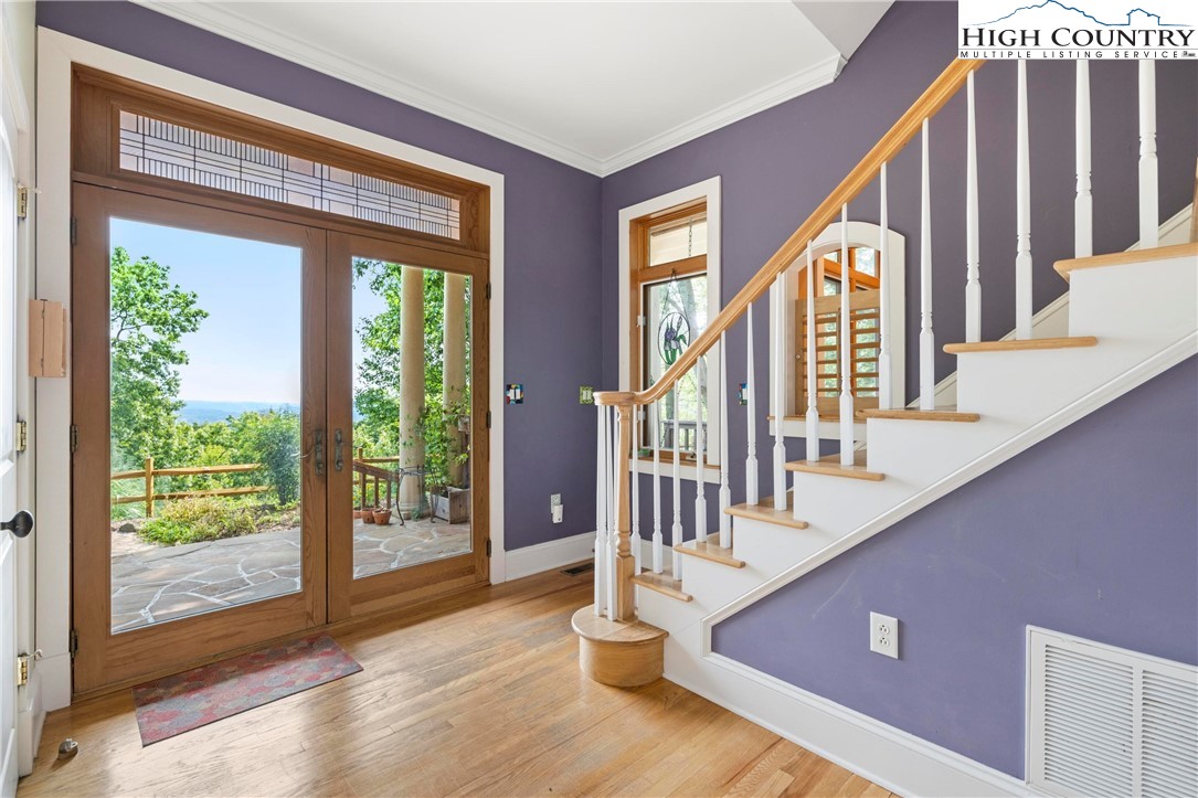 461 Summit Rise Drive Boone, NC 28607 - Photo 9 of 50 a view of an entryway with wooden floor and windows