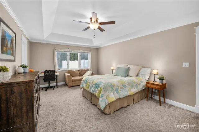 a spacious bedroom with a bed and a couch