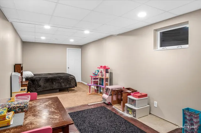 a bedroom with furniture and a wooden floor