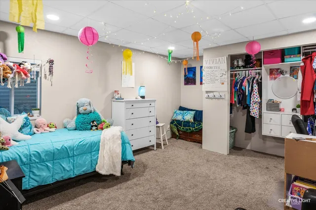 a bedroom with bed and a window