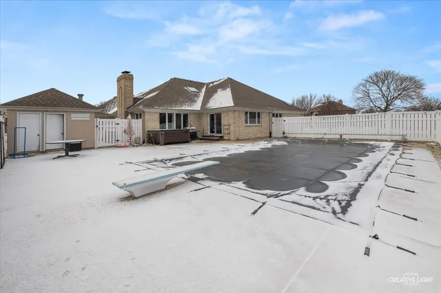a view of large tree in front of a house