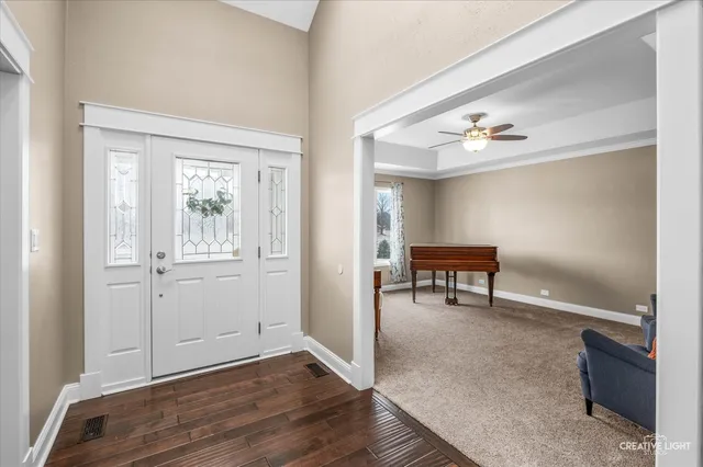 a view of a room with wooden floor table and closet