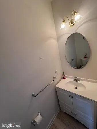 a bathroom with a sink and mirror