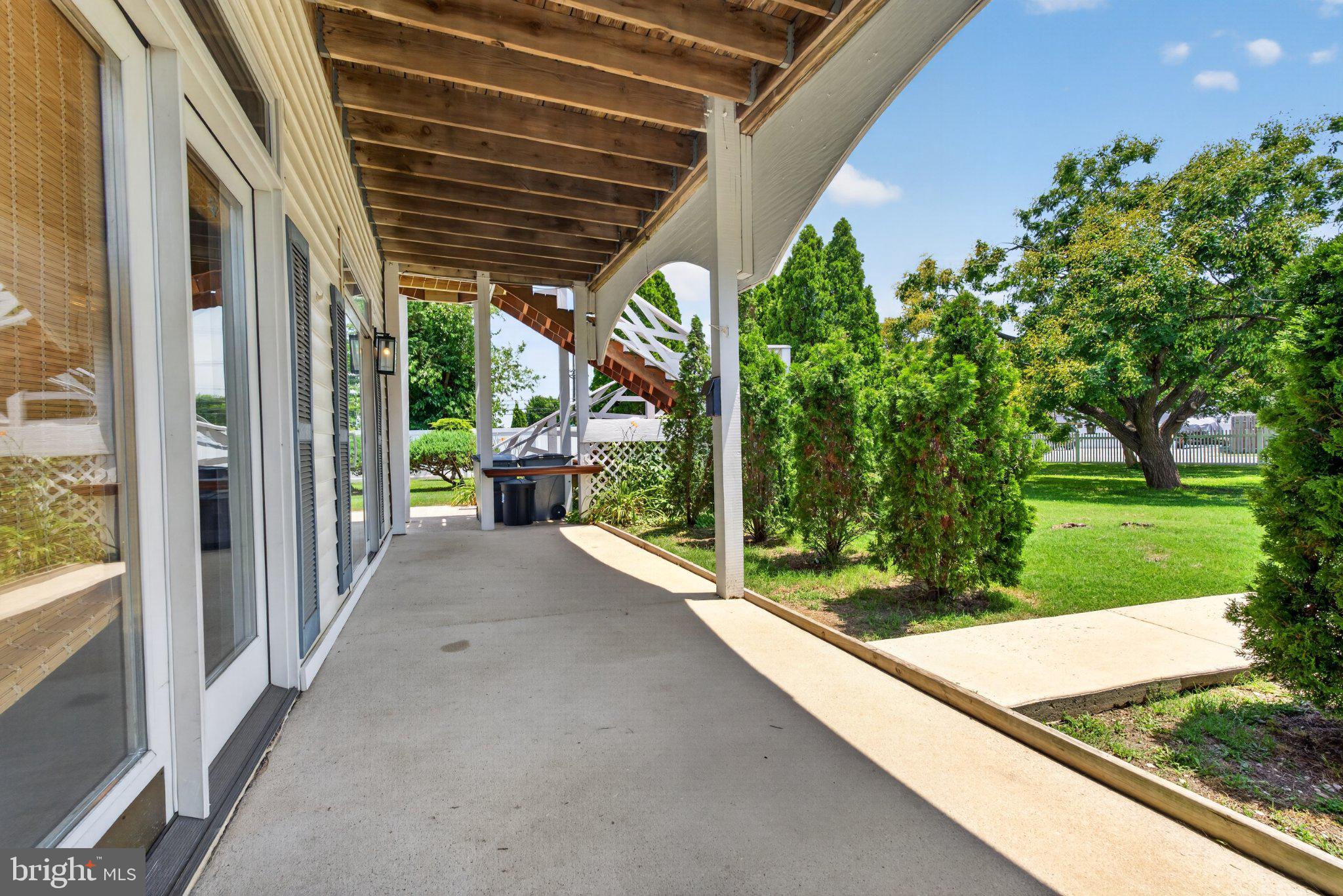 2858 Lodge Farm Road Baltimore, MD 21219 - Photo 22 of 49 Spacious porch with lush greenery.