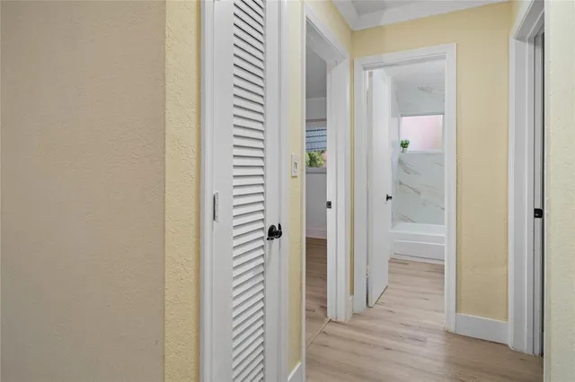 a view of a bathroom from a hallway