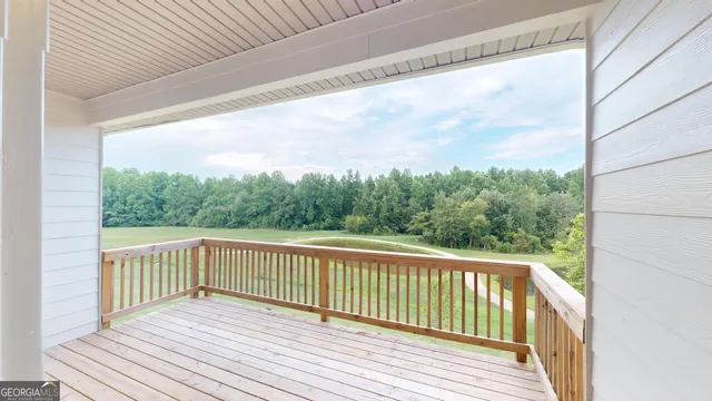 a view of balcony with wooden floor