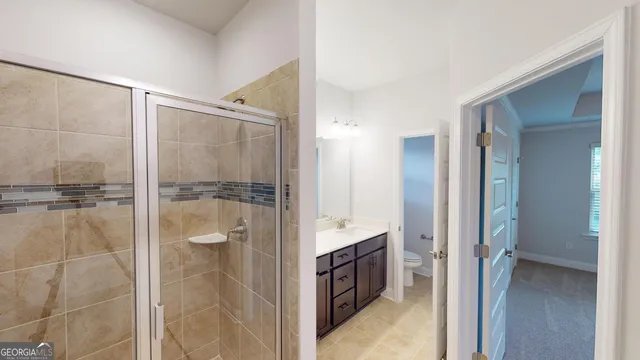 a bathroom with a shower and a sink