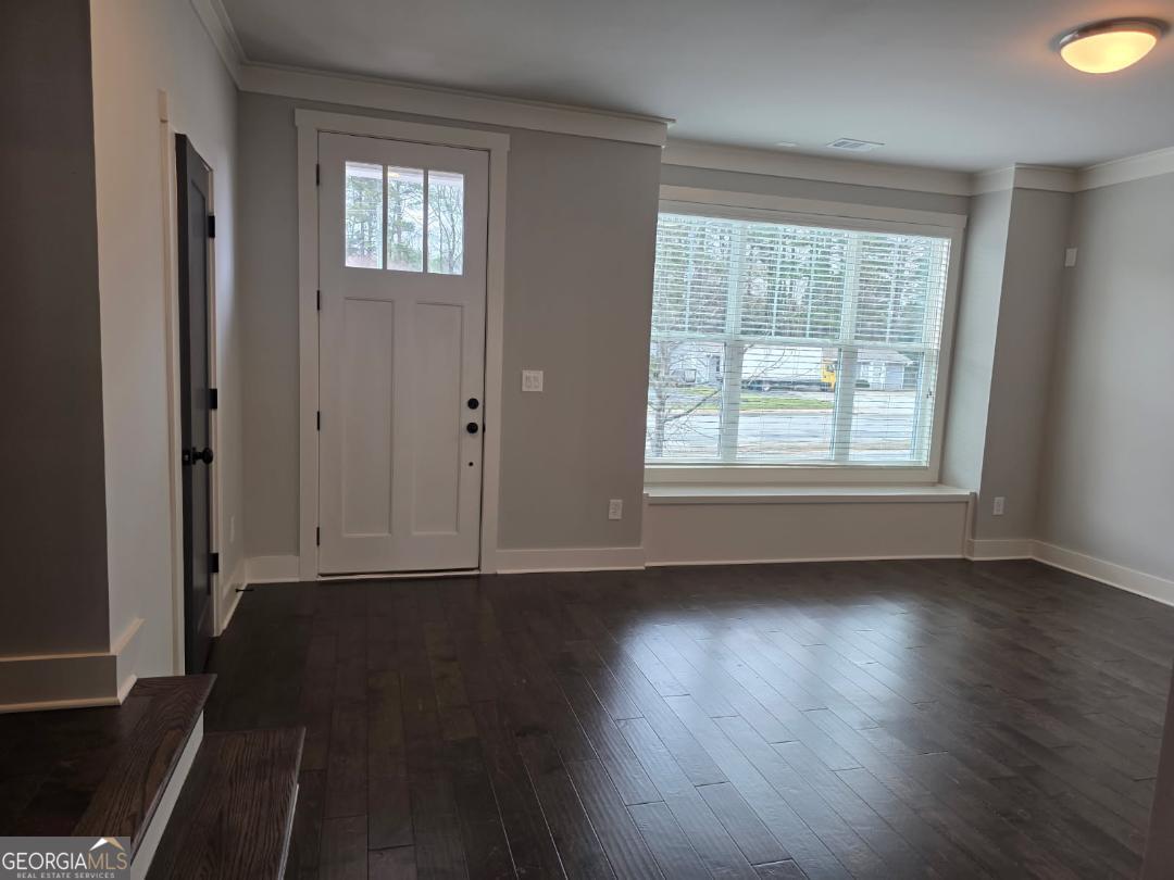 3176 Kincaid Drive Decatur, GA 30033 - Photo 12 of 89 an empty room with wooden floor and windows