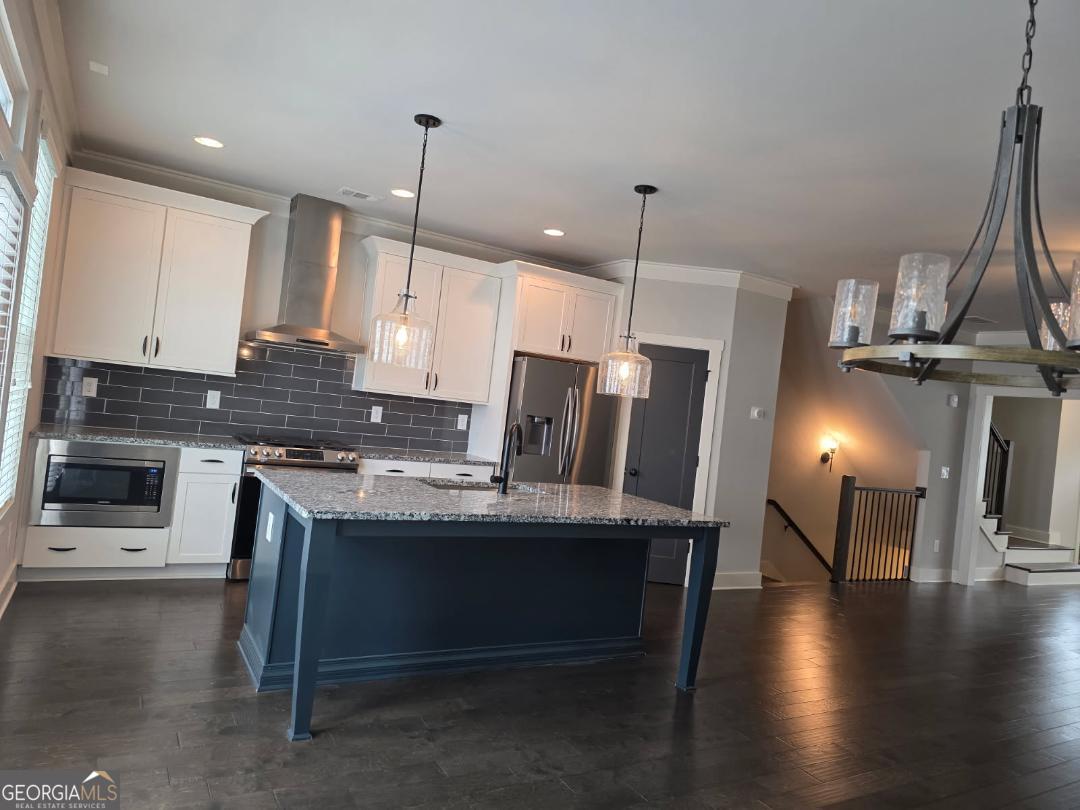 3176 Kincaid Drive Decatur, GA 30033 - Photo 15 of 89 a kitchen with stainless steel appliances kitchen island granite countertop a stove a refrigerator a sink a oven with a dining table and chairs