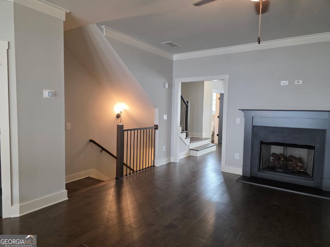 3176 Kincaid Drive Decatur, GA 30033 - Photo 19 of 89 an empty room with wooden floor fireplace and windows