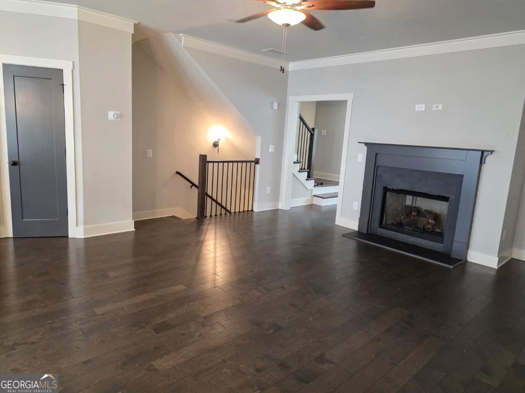 3176 Kincaid Drive Decatur, GA 30033 - Photo 70 of 89 a view of a livingroom with wooden floor a fireplace and window