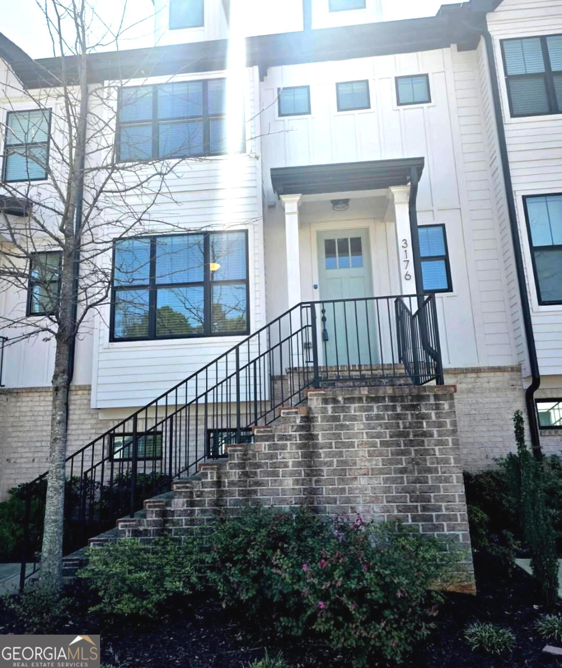 3176 Kincaid Drive Decatur, GA 30033 - Photo 7 of 89 a view of a brick house with many windows