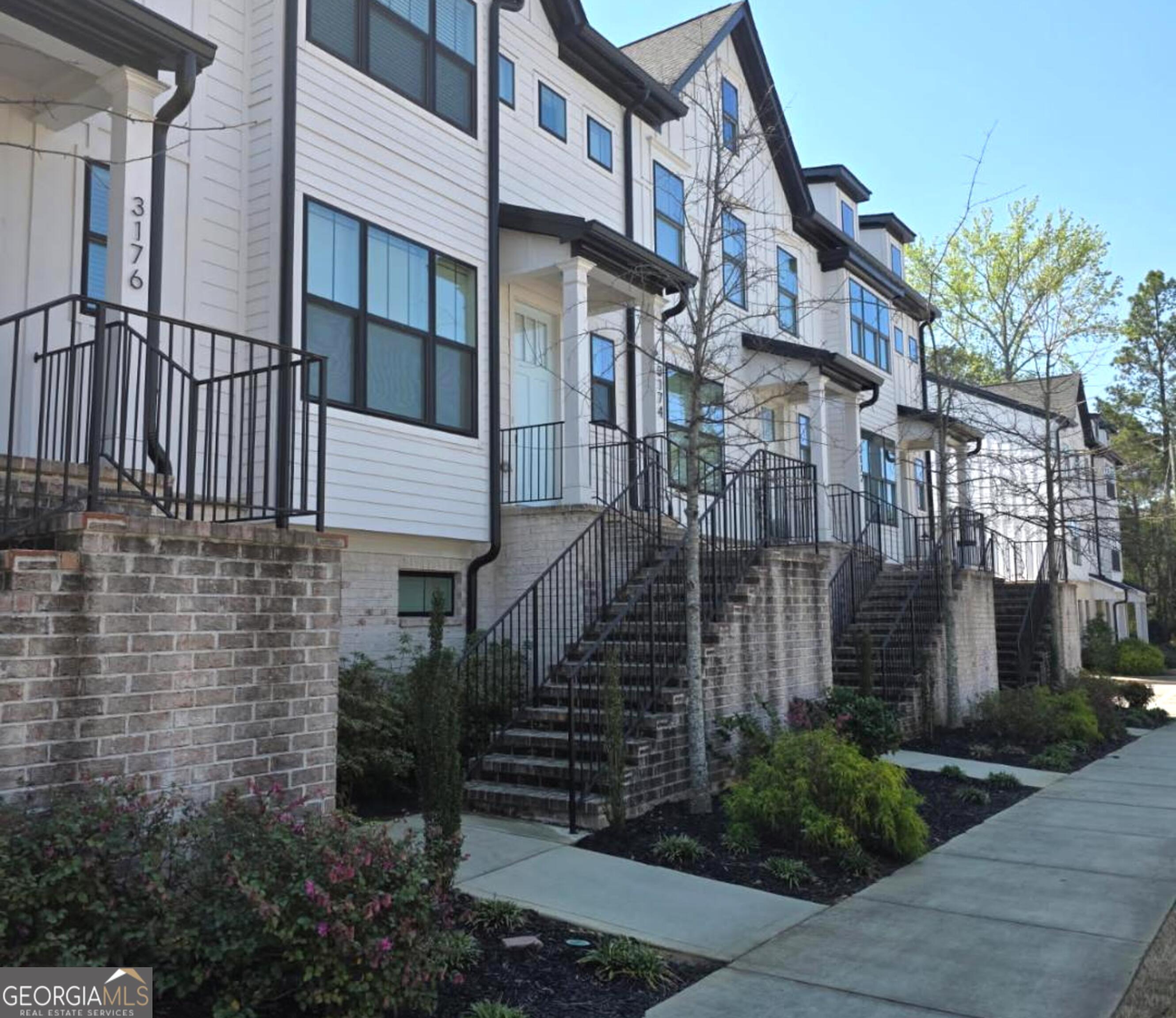 3176 Kincaid Drive Decatur, GA 30033 - Photo 76 of 89 a view of a brick house with many windows