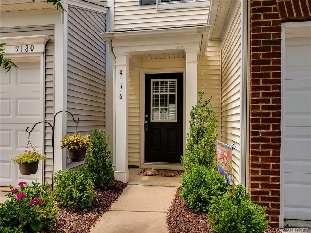 9176 Redmond Trace Road Charlotte, NC 28277 - Photo 2 of 24 a front view of a house with a yard