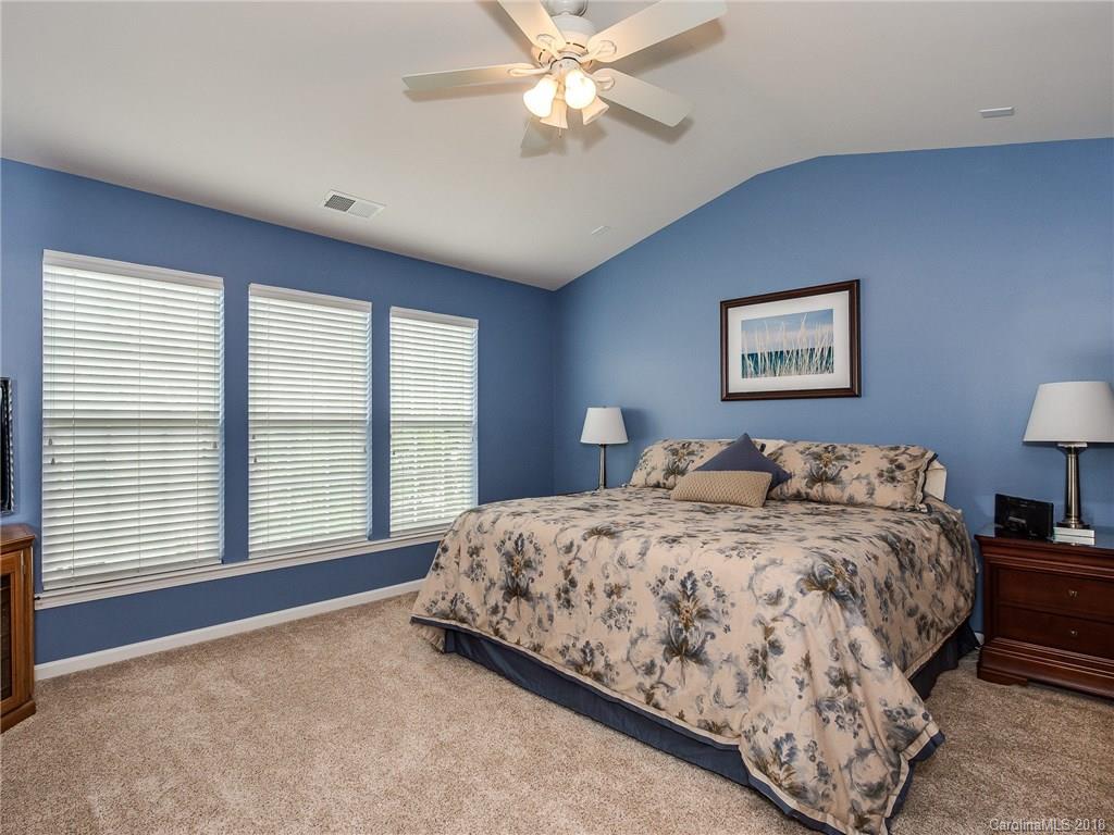 9176 Redmond Trace Road Charlotte, NC 28277 - Photo 13 of 24 a bedroom with a bed and a large window