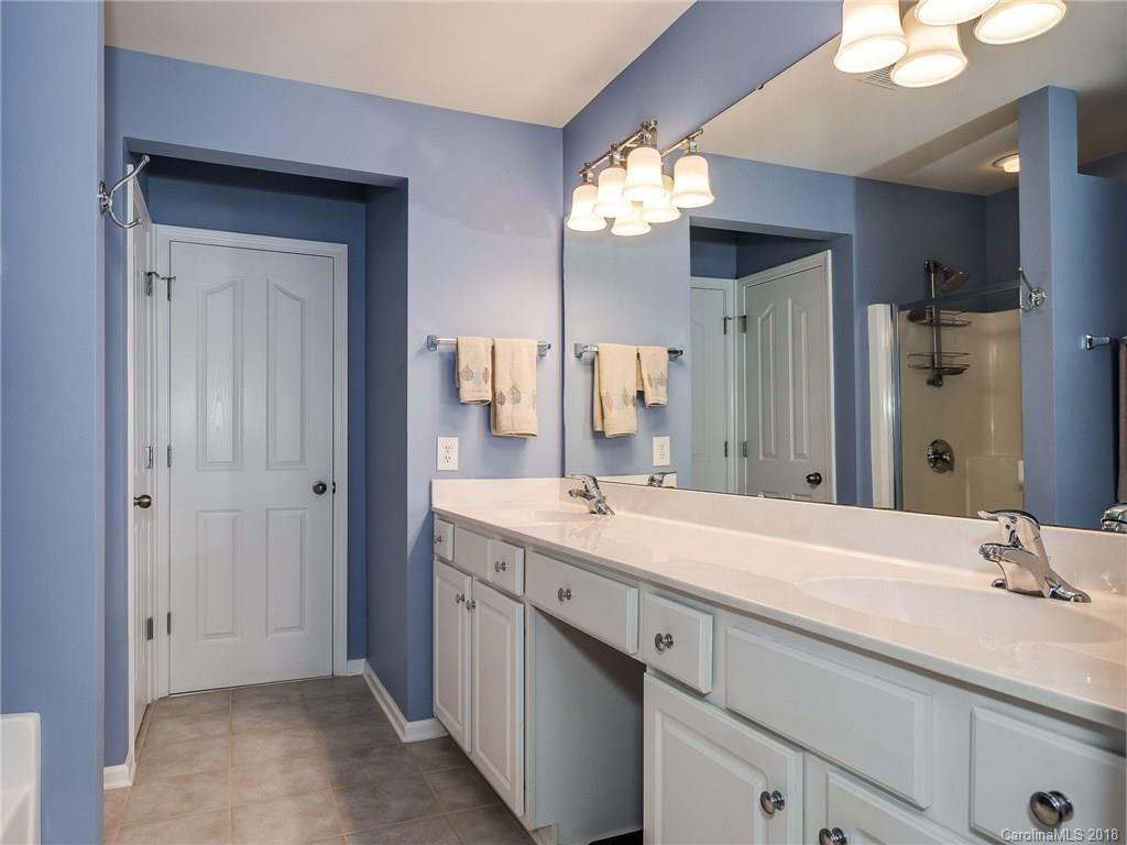 9176 Redmond Trace Road Charlotte, NC 28277 - Photo 14 of 24 a bathroom with a sink and a mirror