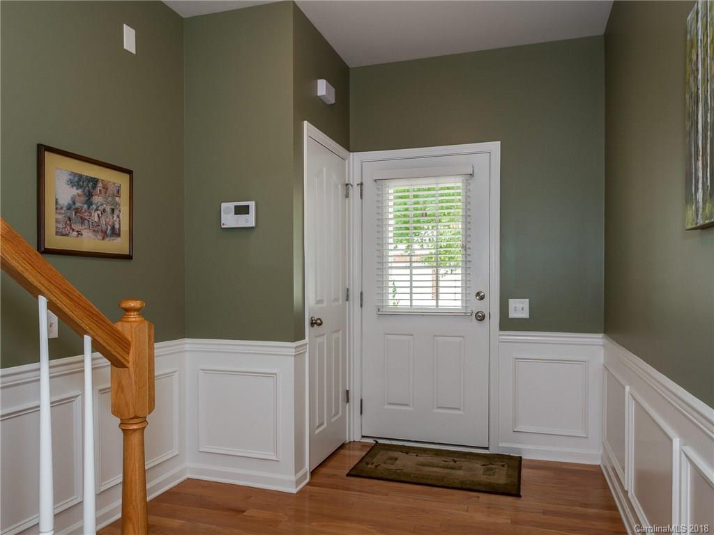 9176 Redmond Trace Road Charlotte, NC 28277 - Photo 3 of 24 a view of an empty room with wooden floor and a window