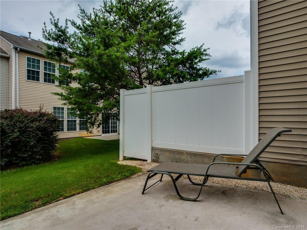 9176 Redmond Trace Road Charlotte, NC 28277 - Photo 21 of 24 a view of backyard with seating space and trees