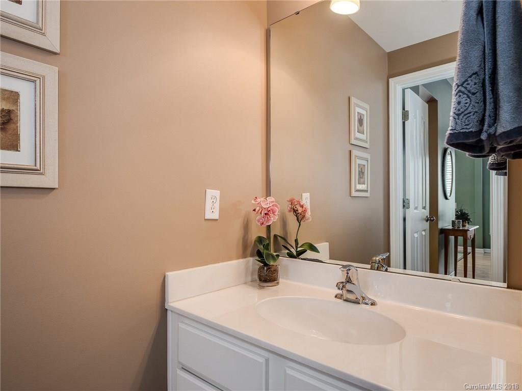 9176 Redmond Trace Road Charlotte, NC 28277 - Photo 9 of 24 a bathroom with a sink and a mirror