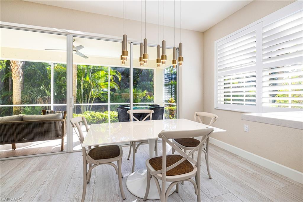 19071 Ridgepoint Drive, Unit 102 Estero, FL 33928 - Photo 12 of 50 a view of a dining room with furniture window and outside view