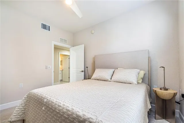 a bedroom with a bed and a table