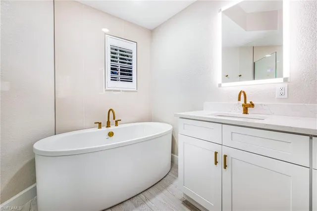 a bathroom with sink and mirror