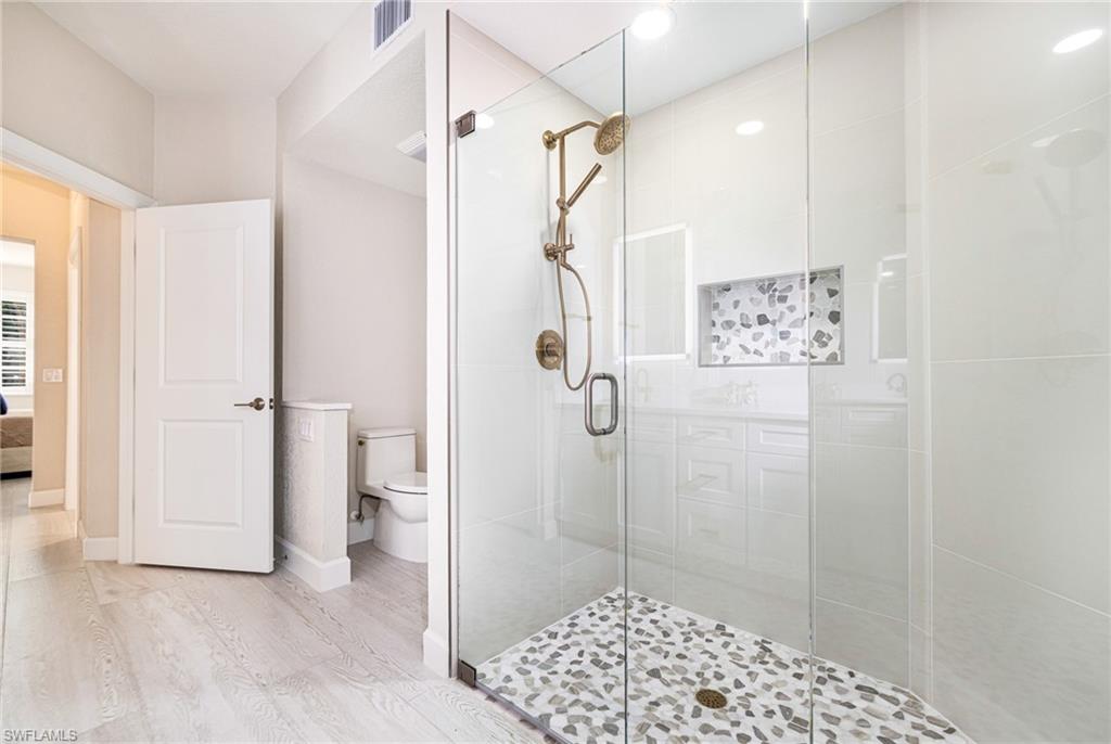 19071 Ridgepoint Drive, Unit 102 Estero, FL 33928 - Photo 28 of 50 a bathroom with a shower and a toilet