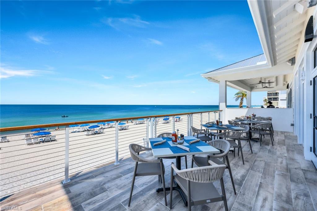 19071 Ridgepoint Drive, Unit 102 Estero, FL 33928 - Photo 48 of 50 a view of a chairs and table in the balcony