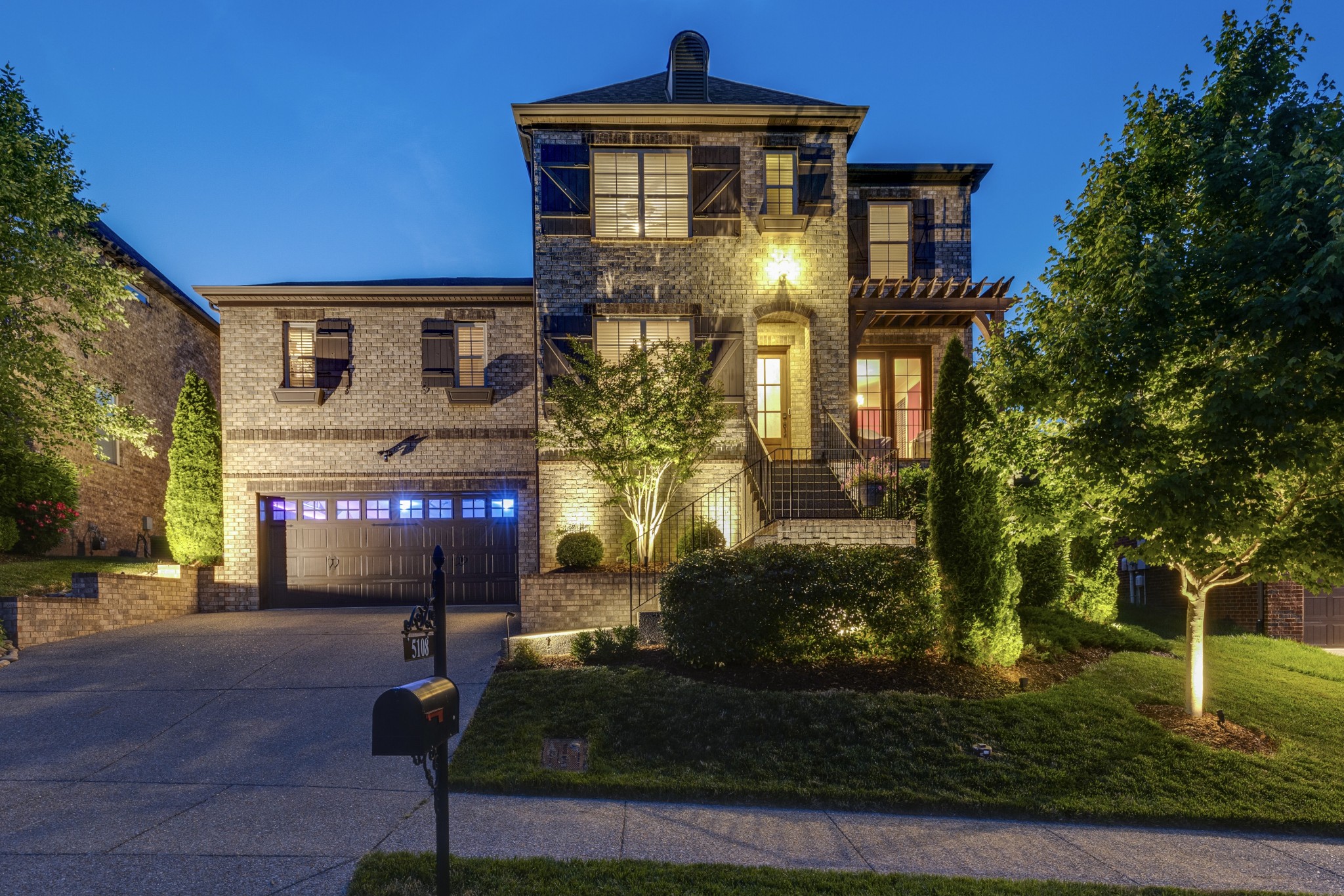 5108 Mountainbrook Circle Hermitage, TN 37076 - Photo 2 of 43 a front view of a house with garden