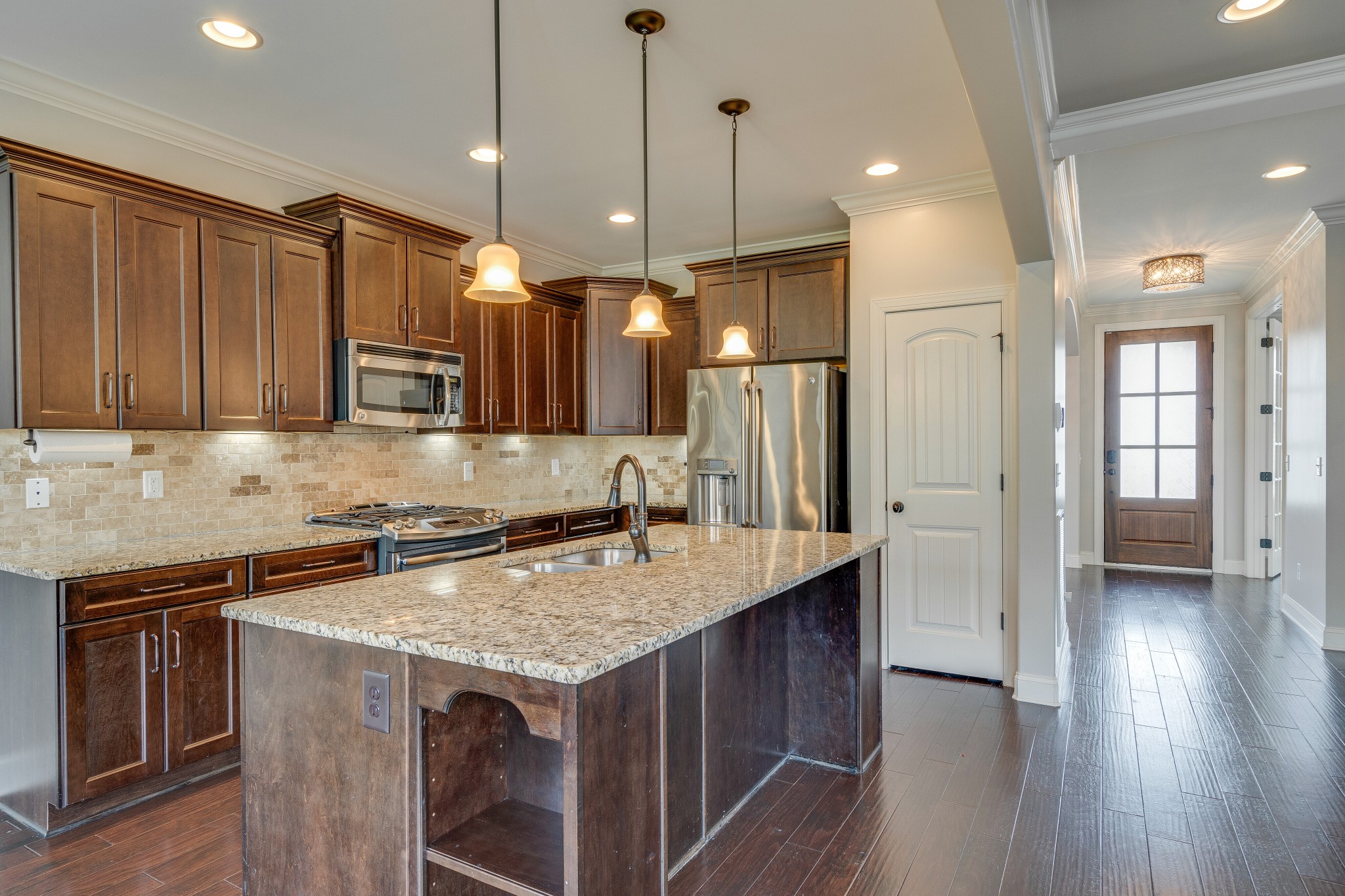 5108 Mountainbrook Circle Hermitage, TN 37076 - Photo 11 of 43 a kitchen with stainless steel appliances granite countertop wooden cabinets a stove a sink and a island