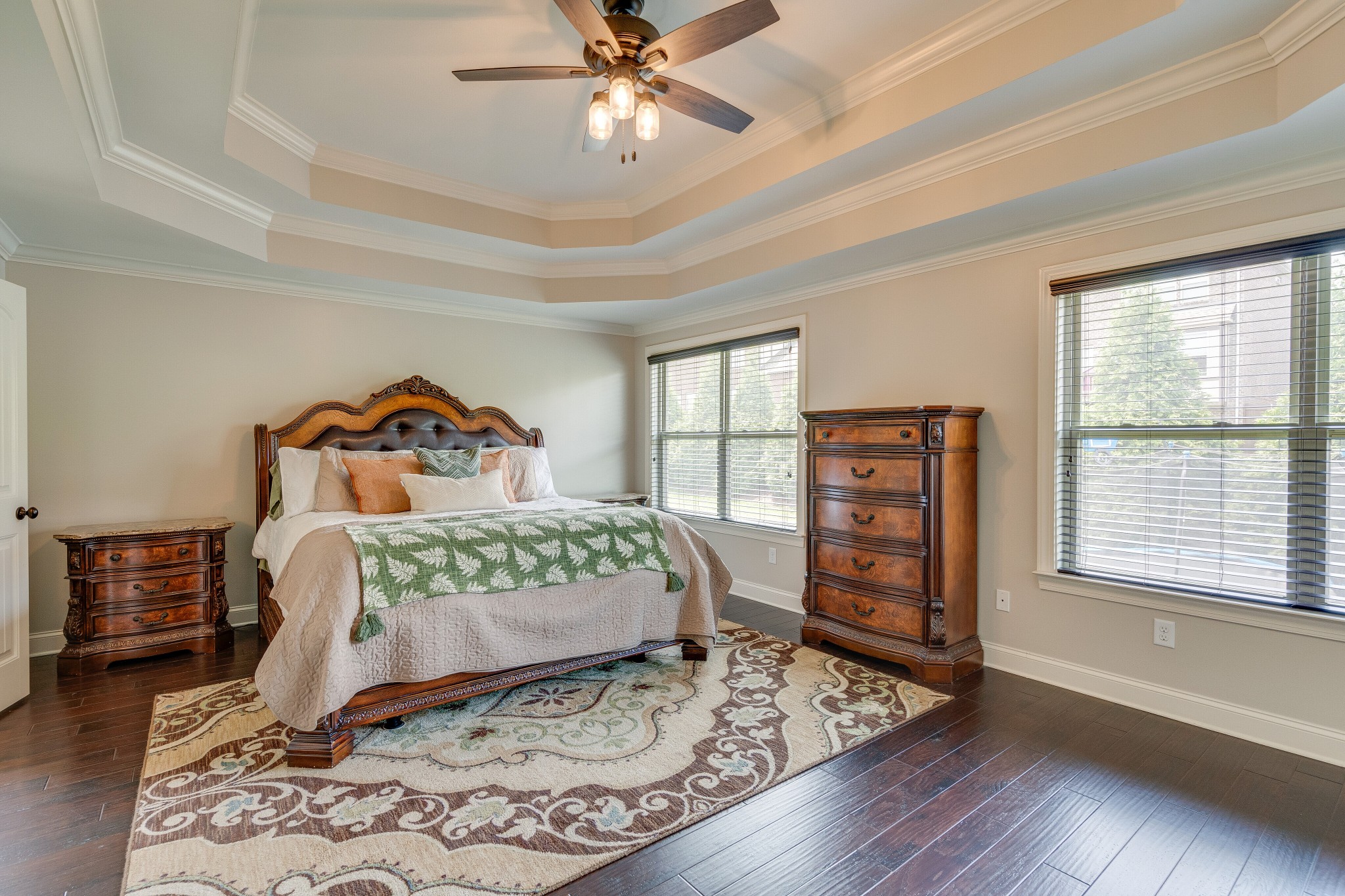 5108 Mountainbrook Circle Hermitage, TN 37076 - Photo 15 of 43 a bedroom with a bed a dresser with wooden floor