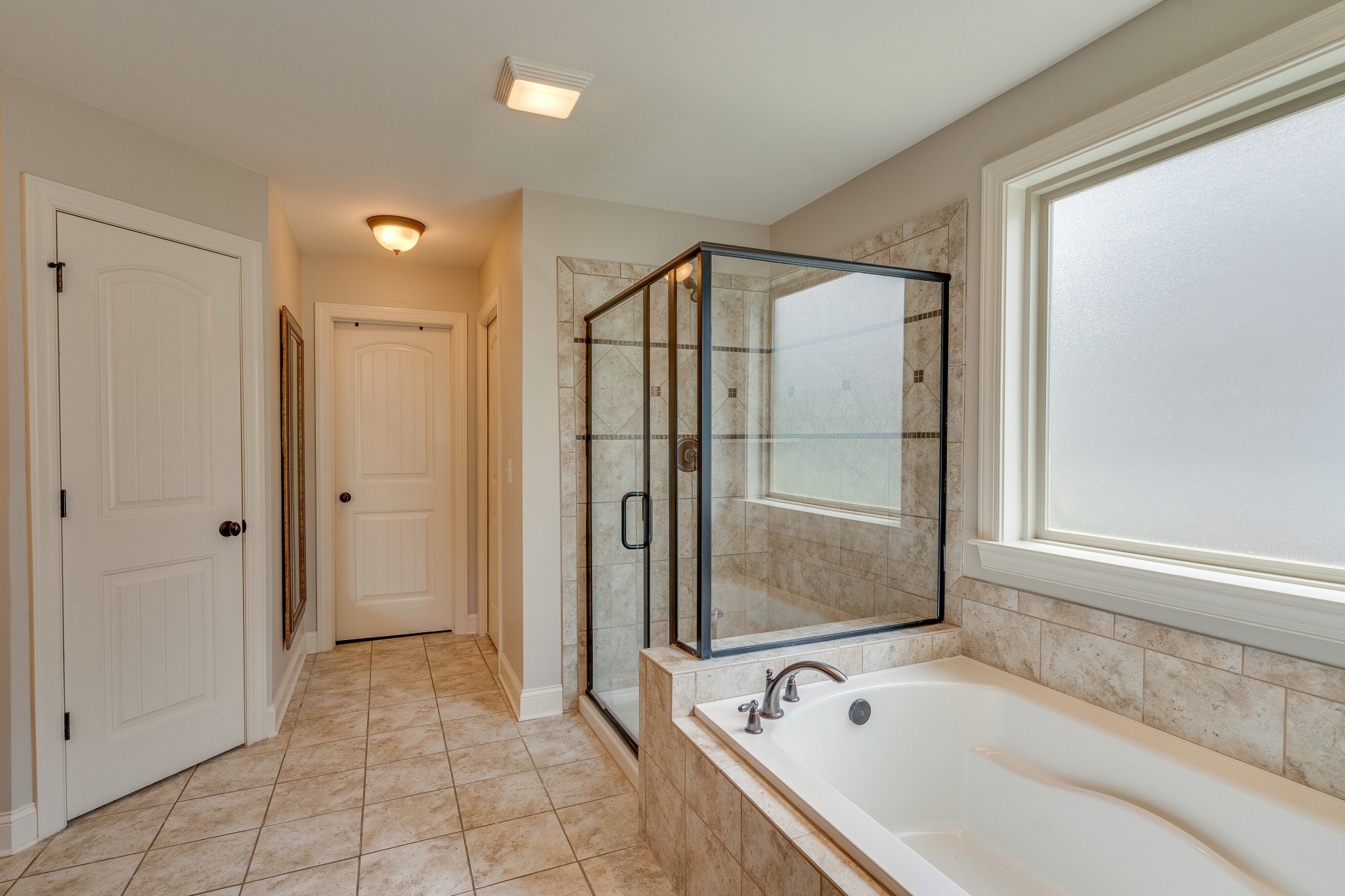5108 Mountainbrook Circle Hermitage, TN 37076 - Photo 16 of 43 a bathroom with a bathtub and a shower