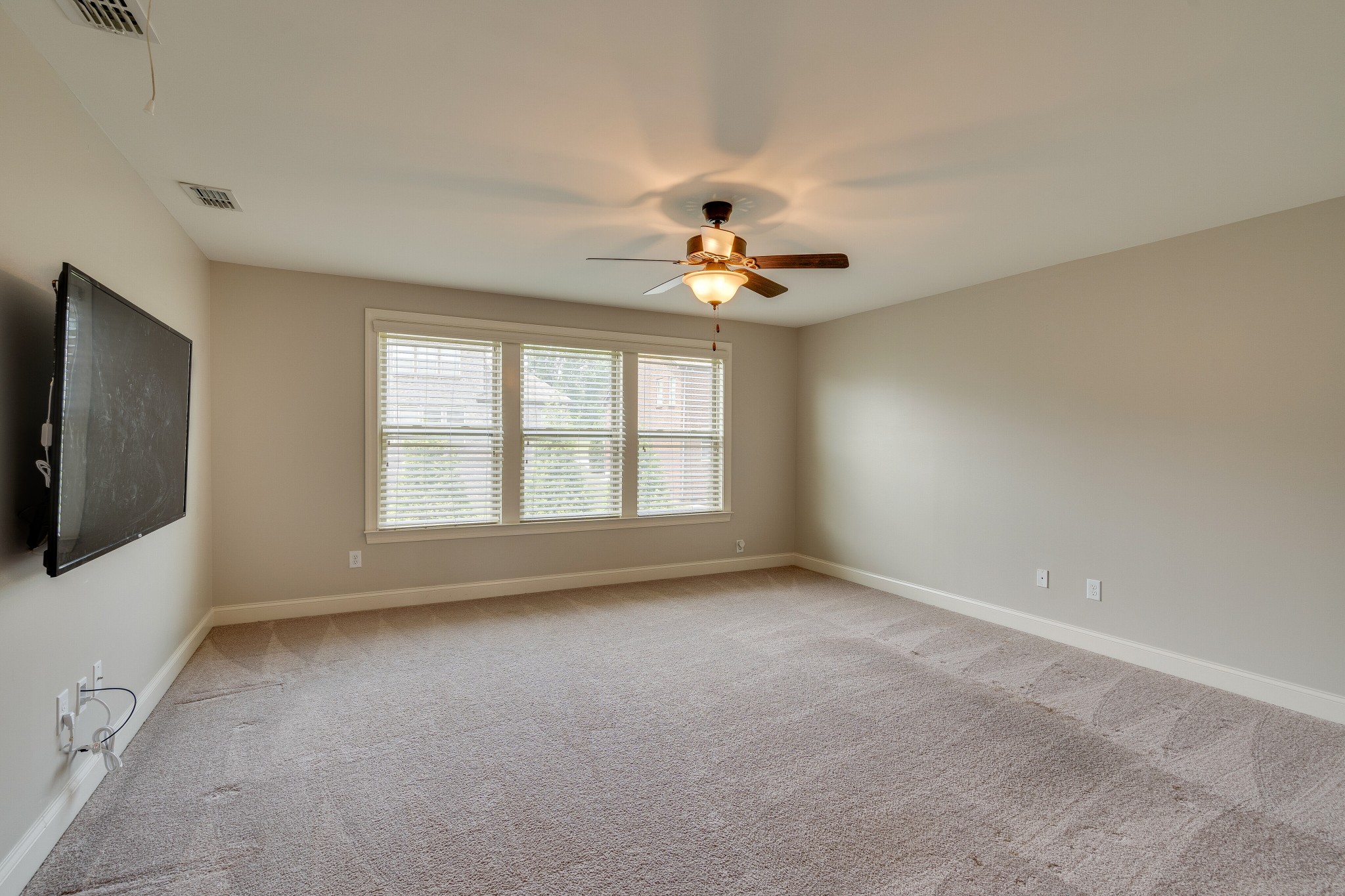 5108 Mountainbrook Circle Hermitage, TN 37076 - Photo 21 of 43 an empty room with chandelier fan and windows