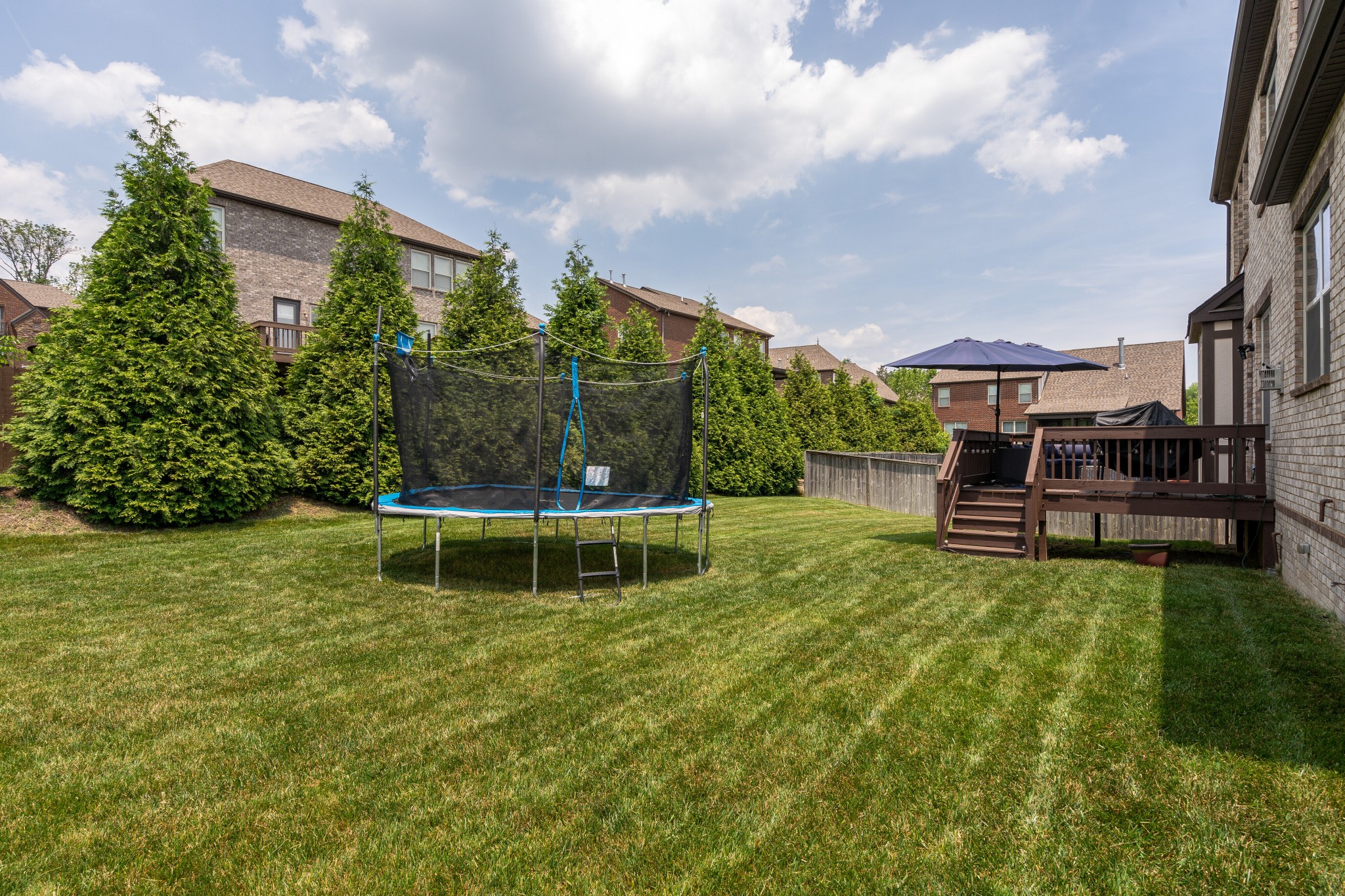 5108 Mountainbrook Circle Hermitage, TN 37076 - Photo 31 of 43 a view of a garden with a bench in front of house