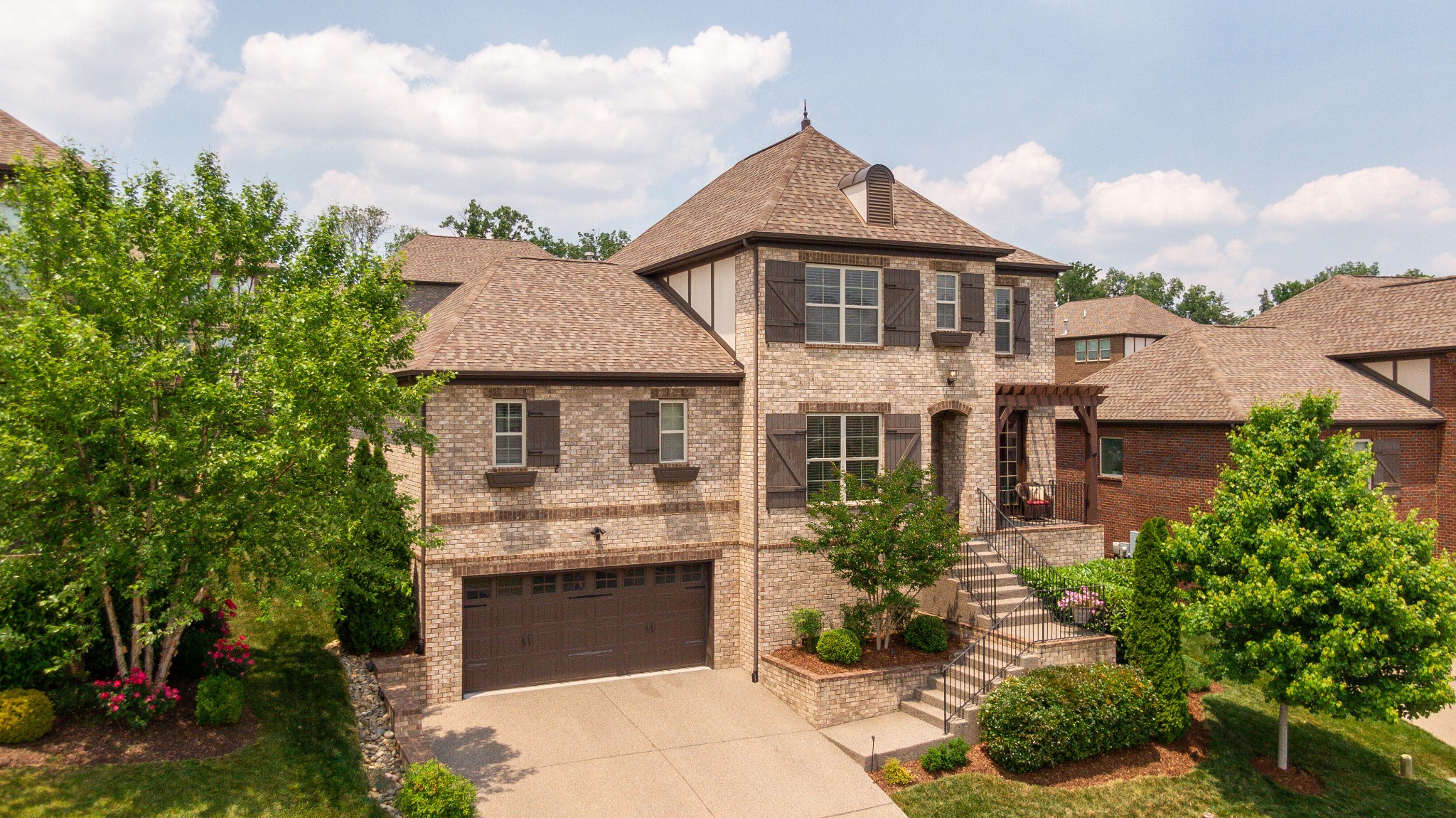 5108 Mountainbrook Circle Hermitage, TN 37076 - Photo 35 of 43 a front view of a house with a garden