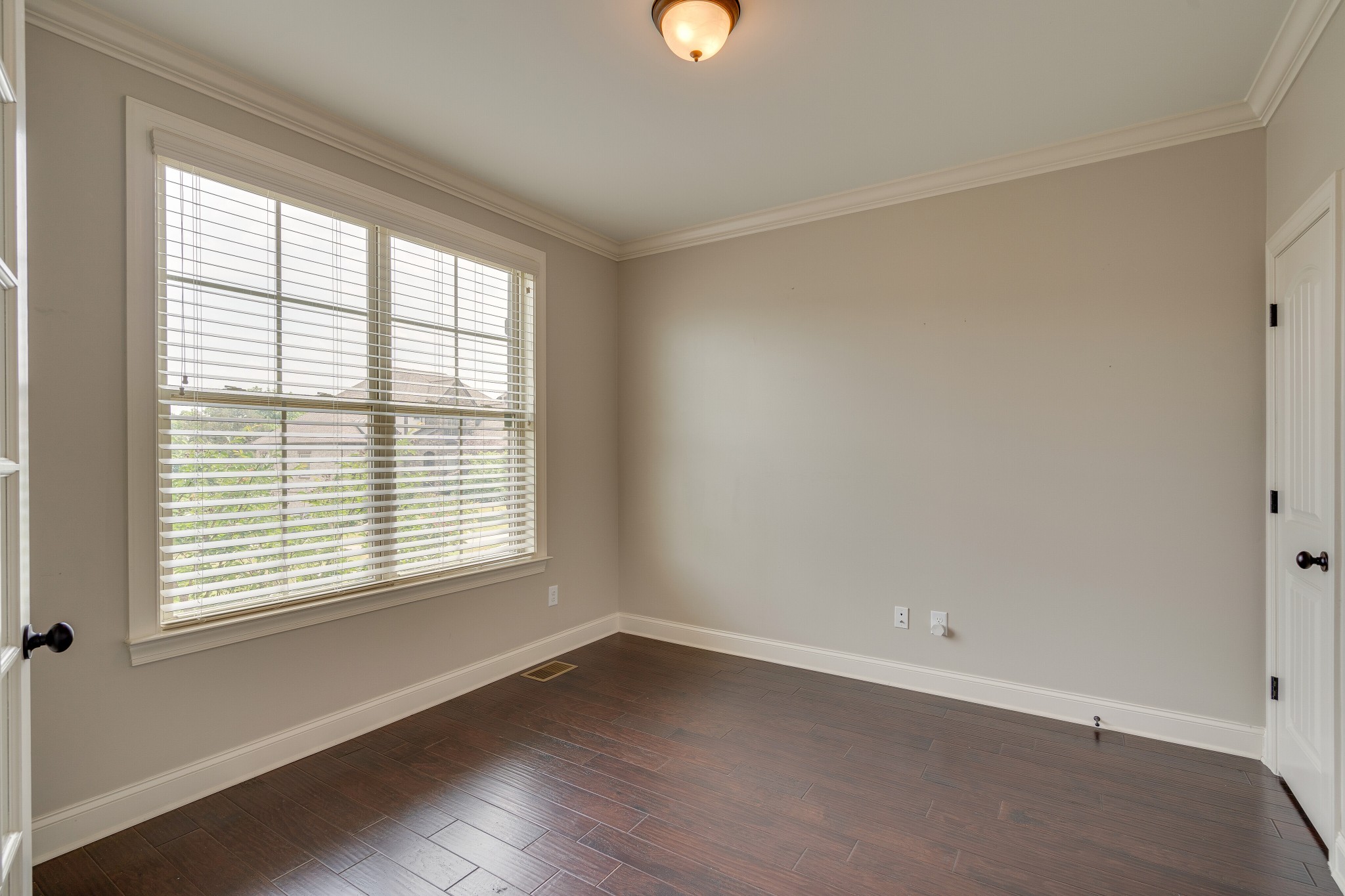 5108 Mountainbrook Circle Hermitage, TN 37076 - Photo 7 of 43 a view of an empty room with wooden floor and a window