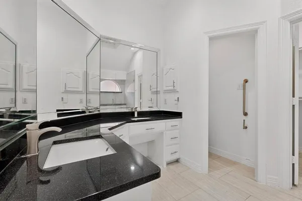 a kitchen with a sink and a refrigerator