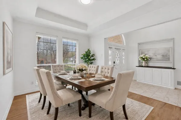 a view of a dining room with furniture window and wooden floor