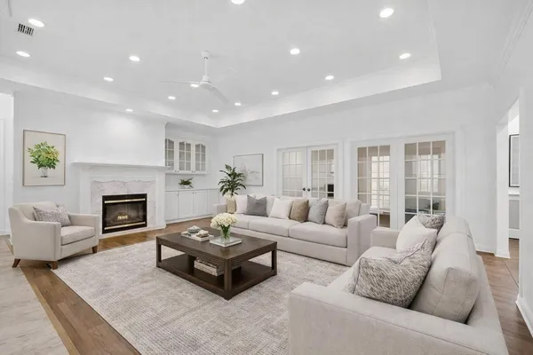 a living room with furniture a fireplace and a table