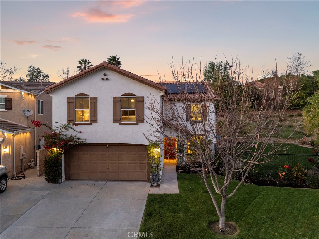 28353 Milbrook Place Castaic, CA 91384 - Photo 1 of 1 a front view of a house with a yard