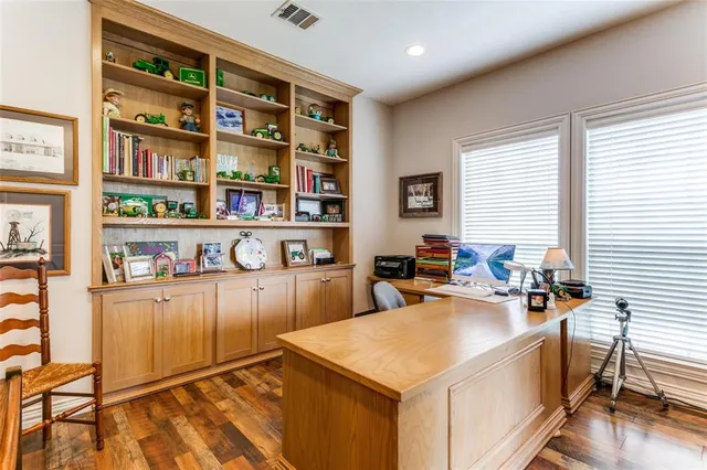 a view of a kitchen with furniture and wooden floor