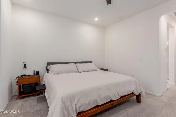 a bedroom with a bed and a lamp