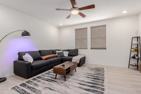 a living room with furniture and a window