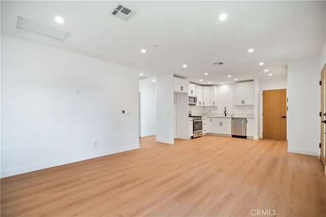 a bathroom with a toilet sink and shower