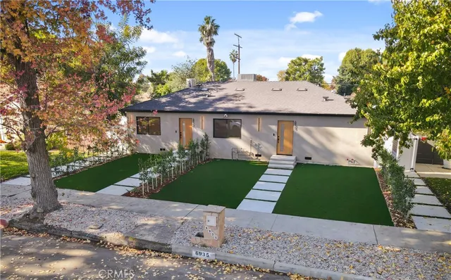 a view of kitchen with stainless steel appliances refrigerator stove microwave and cabinets