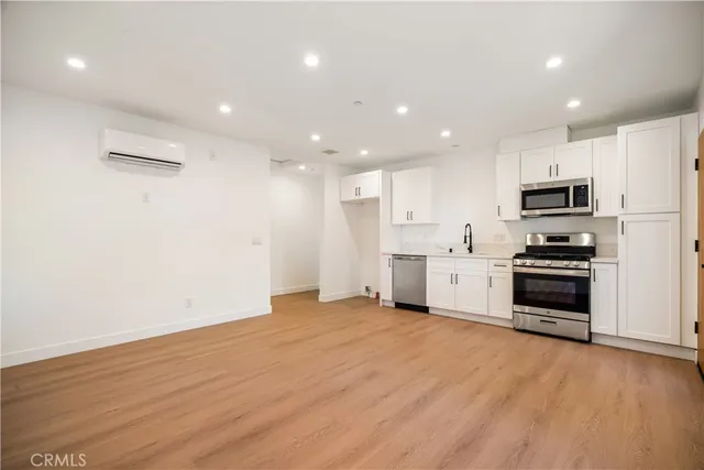a bathroom with a shower toilet and a sink