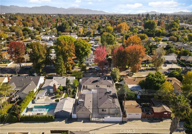 a kitchen with granite countertop white cabinets and stainless steel appliances